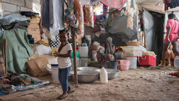 WFP: Photo/Maria Gallar. Families endure overcrowded and unsanitary conditions Haiti, Port au Prince.