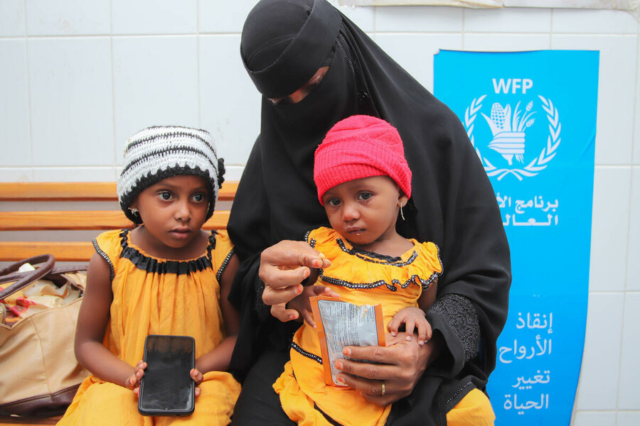 A mother and her children in a WFP-supported clinic in Aden in October. Photo: WFP/Alaa Noman