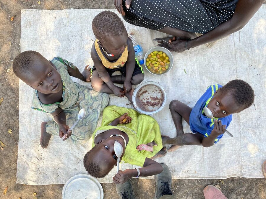 Children take a lunch of sorghum in Bilkey Payam, Akobo county, Jonglei, South Suday in January