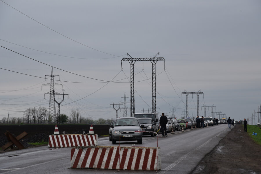 cars queueing at roadblock in Ukraine