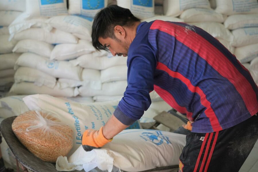 people have come together at PD13 in Kabul to receive their food assistance from the WFP. These people are amongst the most vulnerable, affected by the economic crisis, and are struggling to feed their families.